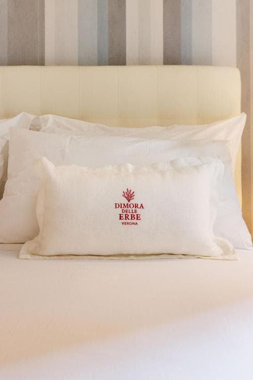 **Comfortable Queen Bed** with Logo Pillow